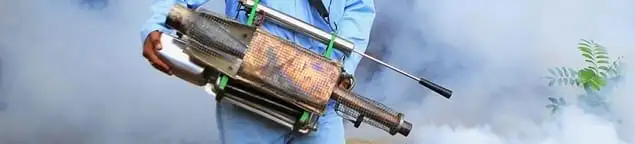Fumigation technician using a fogger for deep pest treatment in Salt Lake City, UT